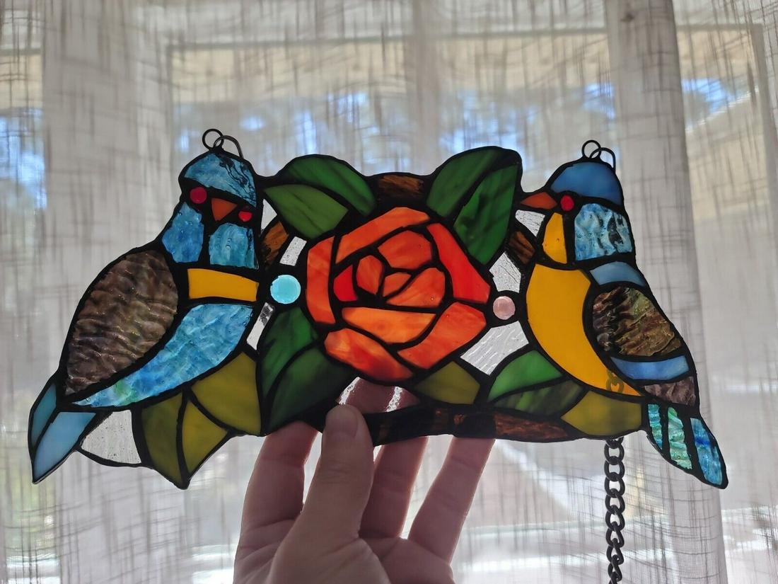 Bird Rose Stained Glass Window Hanging Panel: Description 11 3/4" Wide x 6" tall 22" Hanging height Great reproduction glass panel with 2 little birds and a rose. This piece is hand made from individually cut pieces of glass. The techniques used