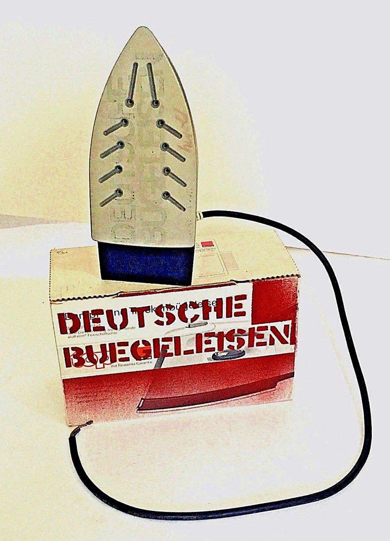 Georg Herold: Deutche Buegeleisen 1990: Deutche Buegeleisen 1990 Artist: Georg Herold Medium: mixed media sculpture with paint Dimensions: 10 1/2" x 6 1/4" x 4 1/4" box, Iron is 10" x 4 1/4" x 5" Additional Information: Stenciled Box and Ir