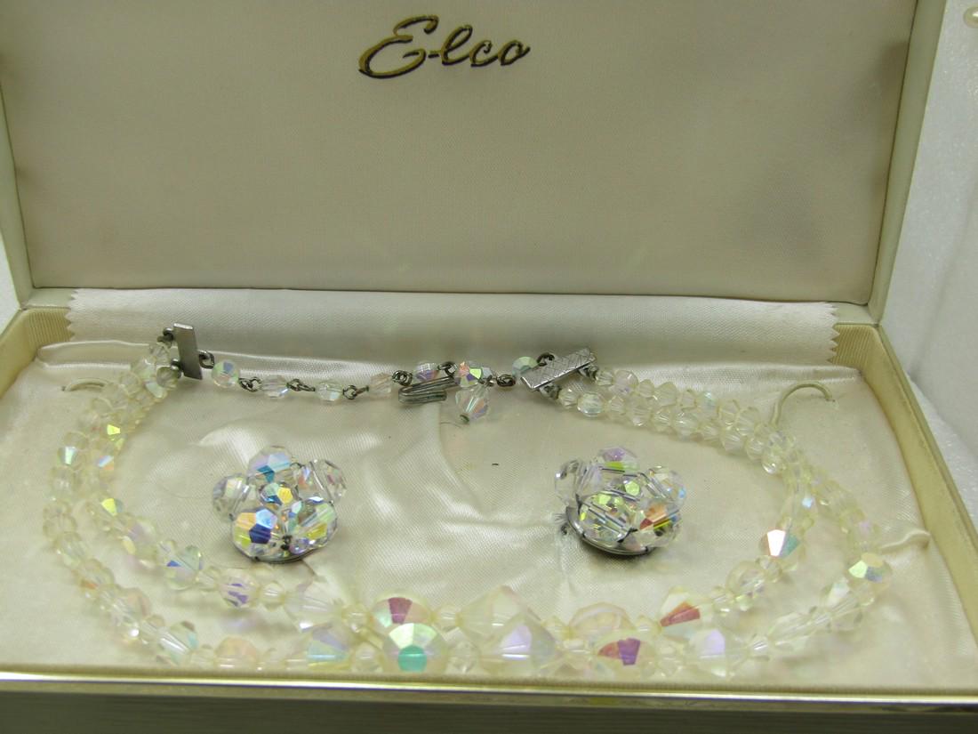Vintage Double Strand Aurora Borealis Neckace & Earrings Demi Parure, Mid-Century, Elco: Vintage Double Strand Aurora Borealis Neckace & Earrings Demi Parure, Mid-Century, Elc. Silver tone end bars to the double strands of aurora borealis crystal beads that are in a diamond faceted shape