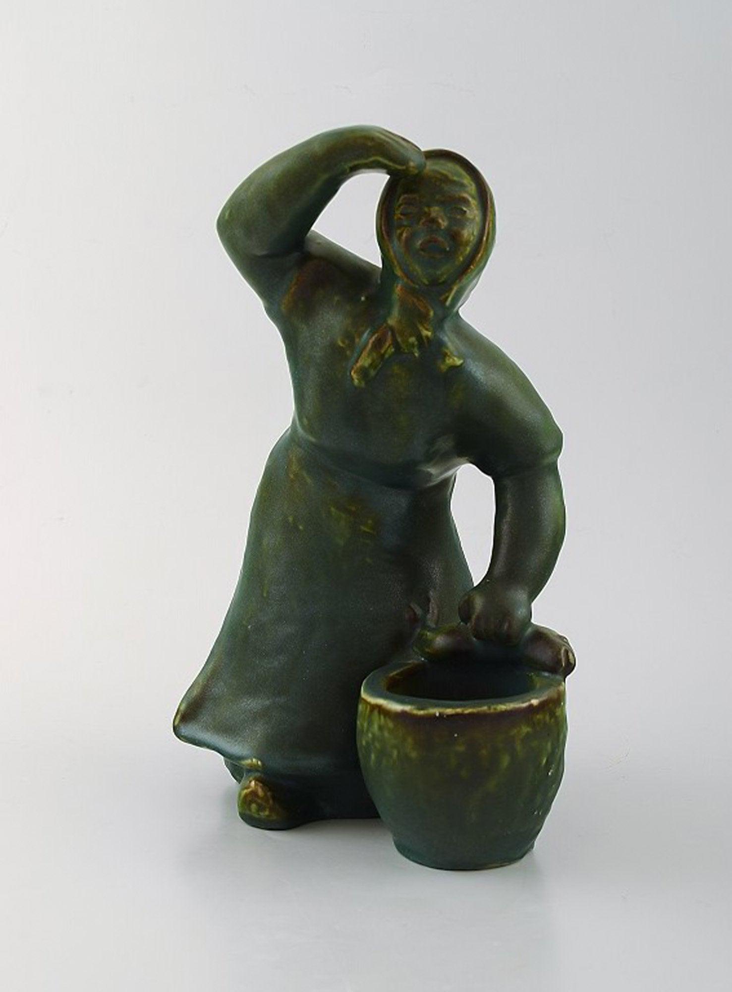 Michael Andersen pottery from Bornholm. Large figure of fisherman's wife.: Michael Andersen pottery from Bornholm. Large figure of fisherman's wife. Measures: 23.5 x 16 cm. Perfect condition. Reserve: $165.00 Shipping: Domestic: Shipping rates are determined by destination I