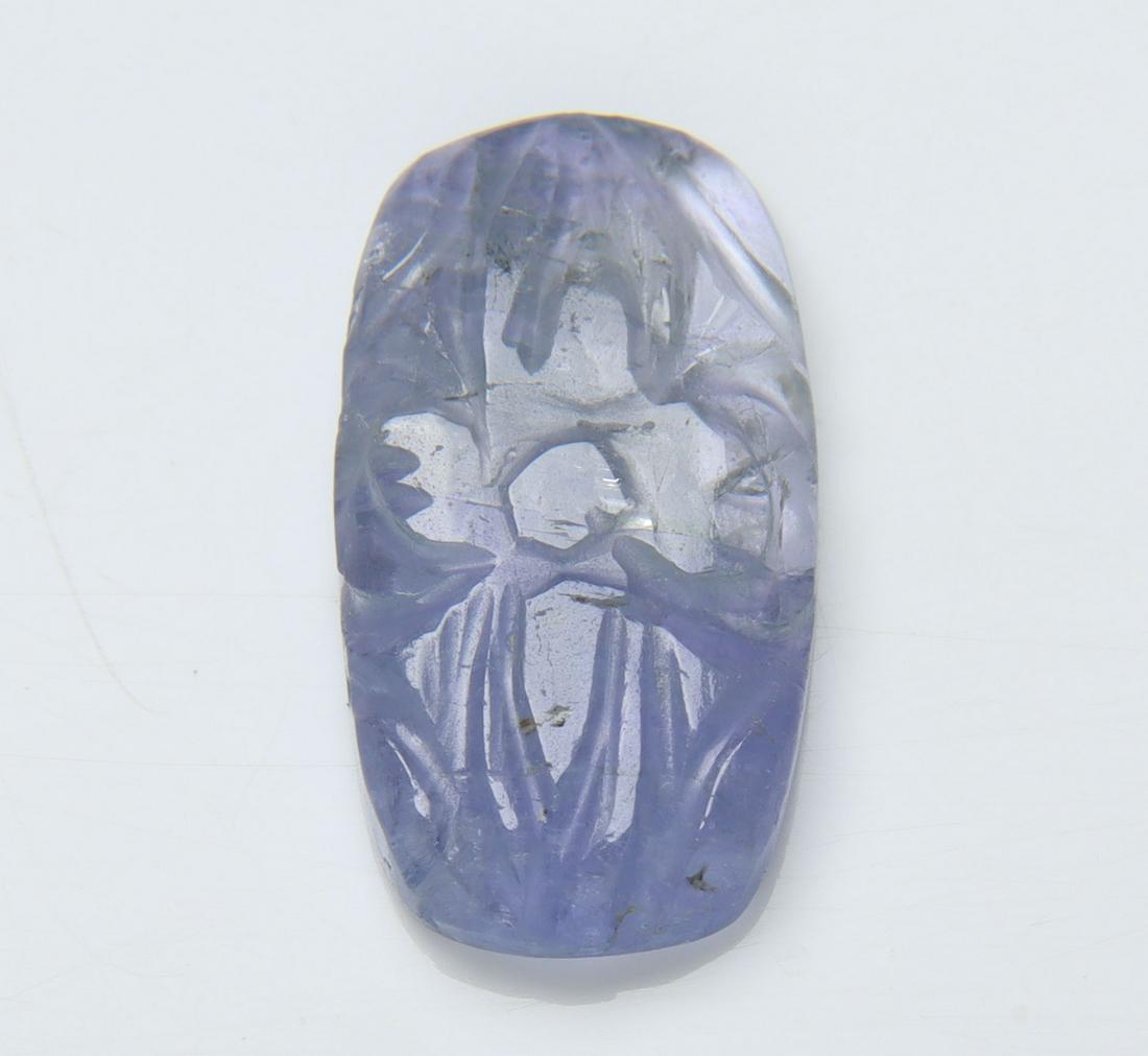 6.80 Cts Natural Tanzanite Carving: No Reserve! Title: 6.80 Cts Natural Tanzanite Carving Additional Information: Gemstone : Natural Tanzanite Carving Origin: Tanzania Weight : 6.80 carats Dimensions : 17.88x9.72x3.37 mm Shape/Cut: Rect