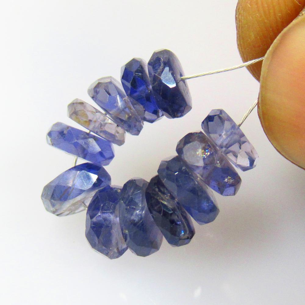 8.51 Ctw Natural 12 Iolite Drilled Round Beads: No Reserve! Title: 8.51 Ctw Natural 12 Iolite Drilled Round Beads Stone Clarity: VVS Gemstones: Iolite Beads Carat Weights: 8.51 Size/Dimensions: 5.80 - 6.50 mm / 12 P'cs Additional Information: Very