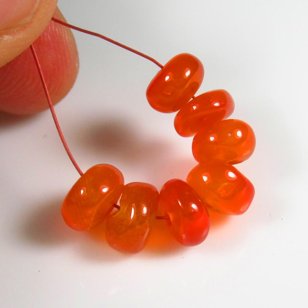 Natural Carnelian Beads - 10.14 Ct: No Reserve! Title: Natural Carnelian Beads - 10.14 Ct Origin: Brazil Weight: 10.14 Size/Dimensions: 7.0 - 7.5 mm Additional Information: Pieces : 7 No's / Shape : Drilled Round Beads / Color : Orange 