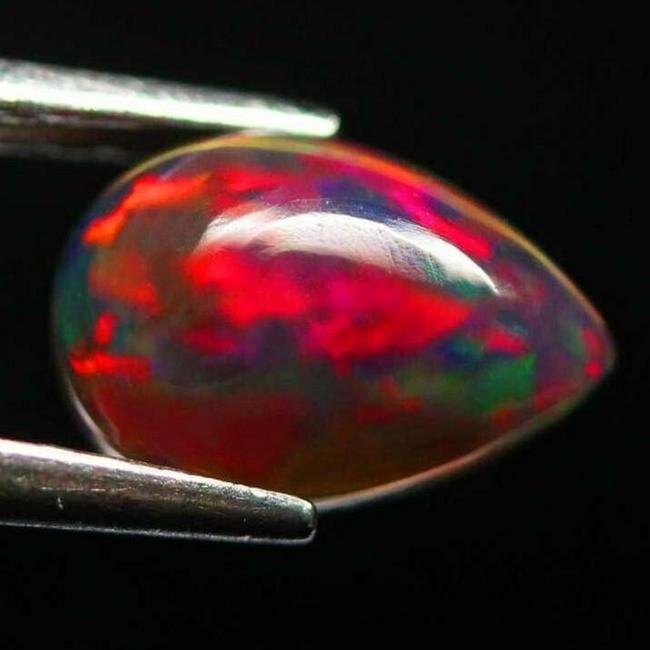 Unheated Natural Multicolor Welo Ethiopian Black Opal Pear Shape: Title: Unheated Natural Multicolor Welo Ethiopian Black Opal Pear ShapeGemstones: OpalCarat Weights: 1,23Size/Dimensions: 9,1 x 6 x 4,7 mmAdditional Information: Specie: Natural opal Unheated - 1,23 c