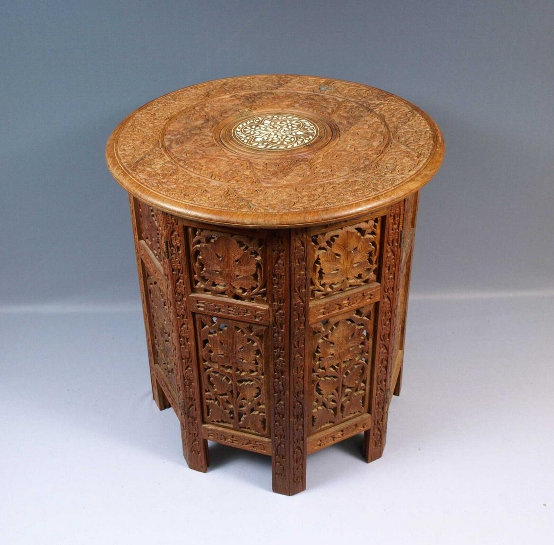Carved Wood Rosewood Teak Folding Anglo-Indian Wine Coffee TABLE Folding inlays: This is a quality example of the classic late 19th early 20th century Indian Carved table on a folding wood base. The table is in very good antique order. It has pleasing detailing on the top with whi
