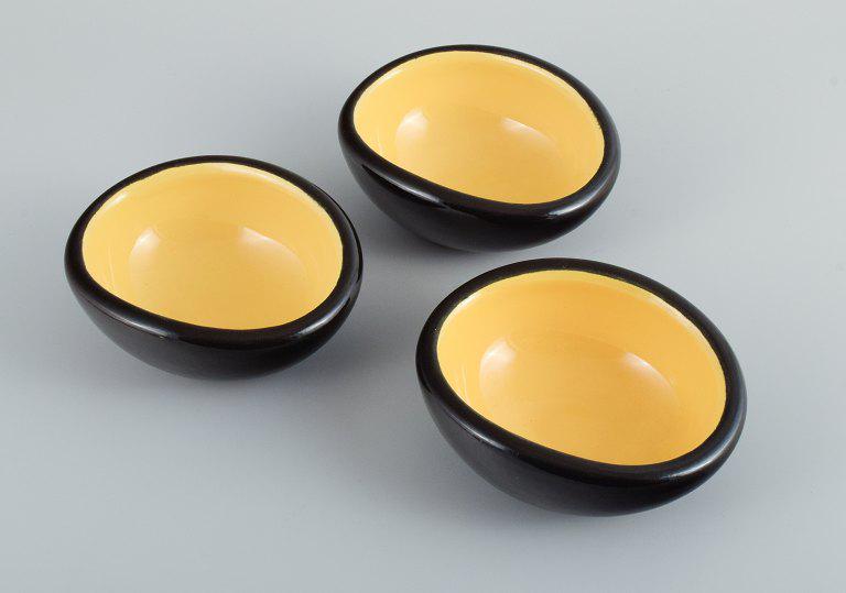 Keramos, Sèvres, France. 3 unique ceramic bowls glazed in yellow and black. (1 of 5)