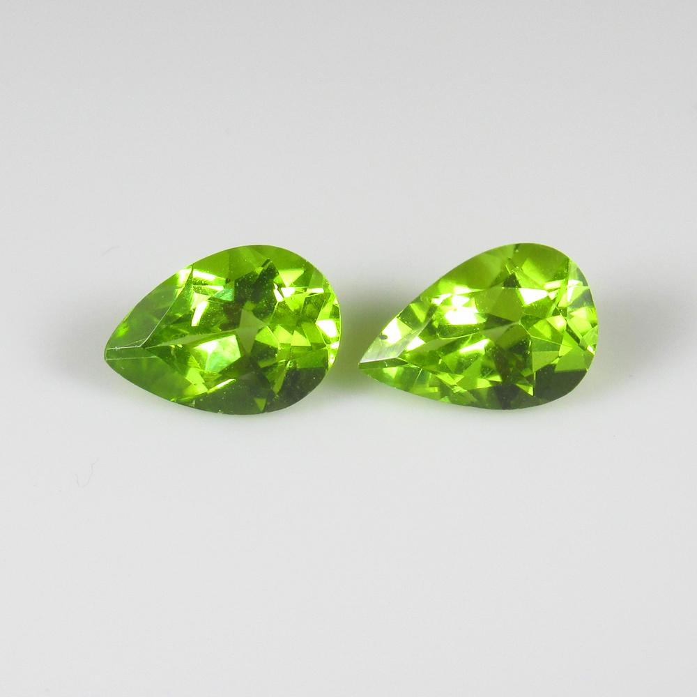Natural Green Peridot Pair- 1.49 Ct: No Reserve! Title: Natural Green Peridot Pair- 1.49 Ct Origin: Pakistan Weight: 1.49 Size/Dimensions: 7.0 x 5.0 x 3.3 mm Additional Information: Pieces : 2 No's / Shape : Pear Cut / Color : Green / Cl