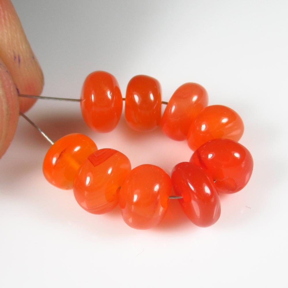 Natural Carnelian Beads - 13.55 Ct: No Reserve! Title: Natural Carnelian Beads - 13.55 Ct Origin: Brazil Weight: 13.55 Size/Dimensions: 6.8 - 7.2 mm Additional Information: Pieces : 9 No's / Shape : Drilled Round Beads / Color : Orange 