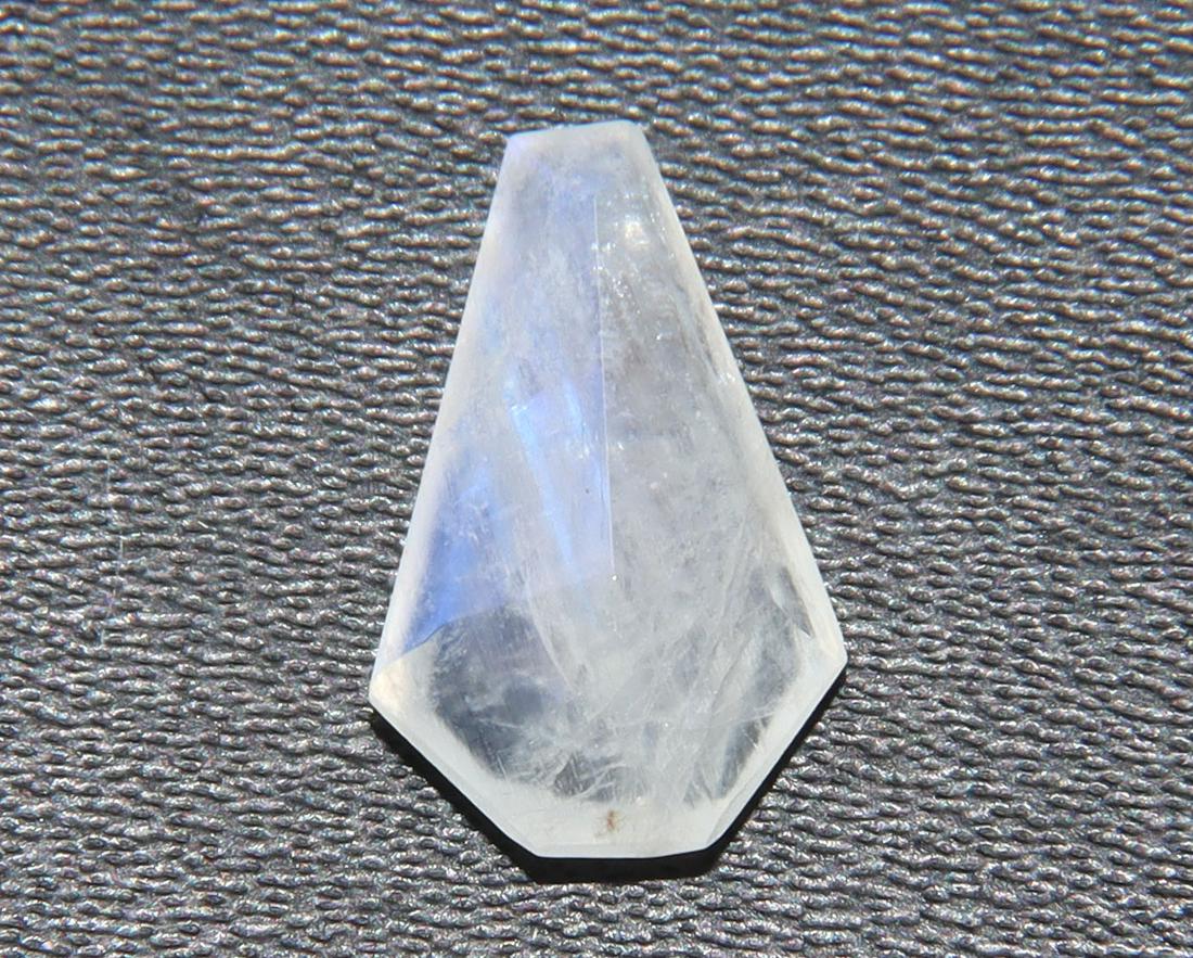 2.60 Cts Natural Rainbow Moonstone: No Reserve! Title: 2.60 Cts Natural Rainbow Moonstone Additional Information: Gemstone : Natural Rainbow Moonstone Shape : Coffin Cut Weight : 2.60 carats Measurements : 13x8 mm, Color : White Transpa