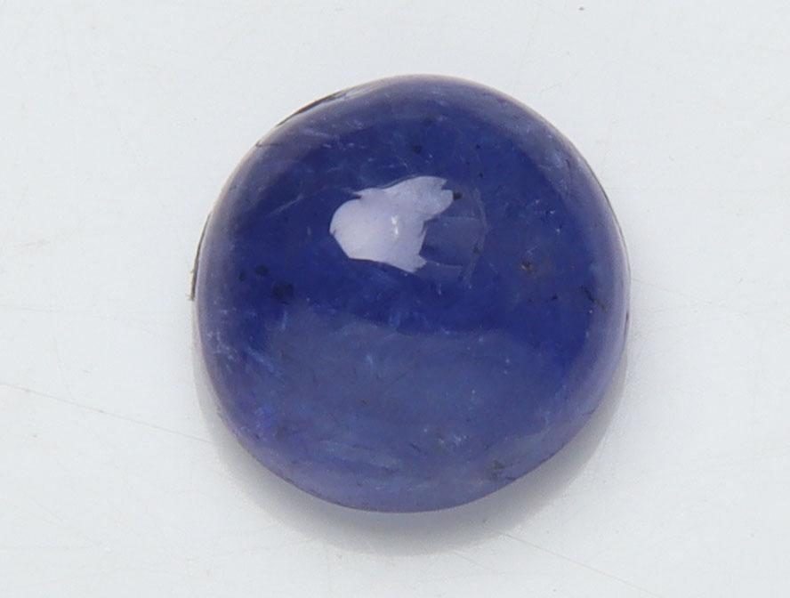 1.38 Cts Natural Tanzanite: No Reserve! Title: 1.38 Cts Natural Tanzanite Additional Information: Gemstone : Natural Tanzanite Origin: Tanzania Weight : 1.38 carats Dimensions : 6.40-6.27x3.86 mm Shape/Cut: Round Cabochan Color 