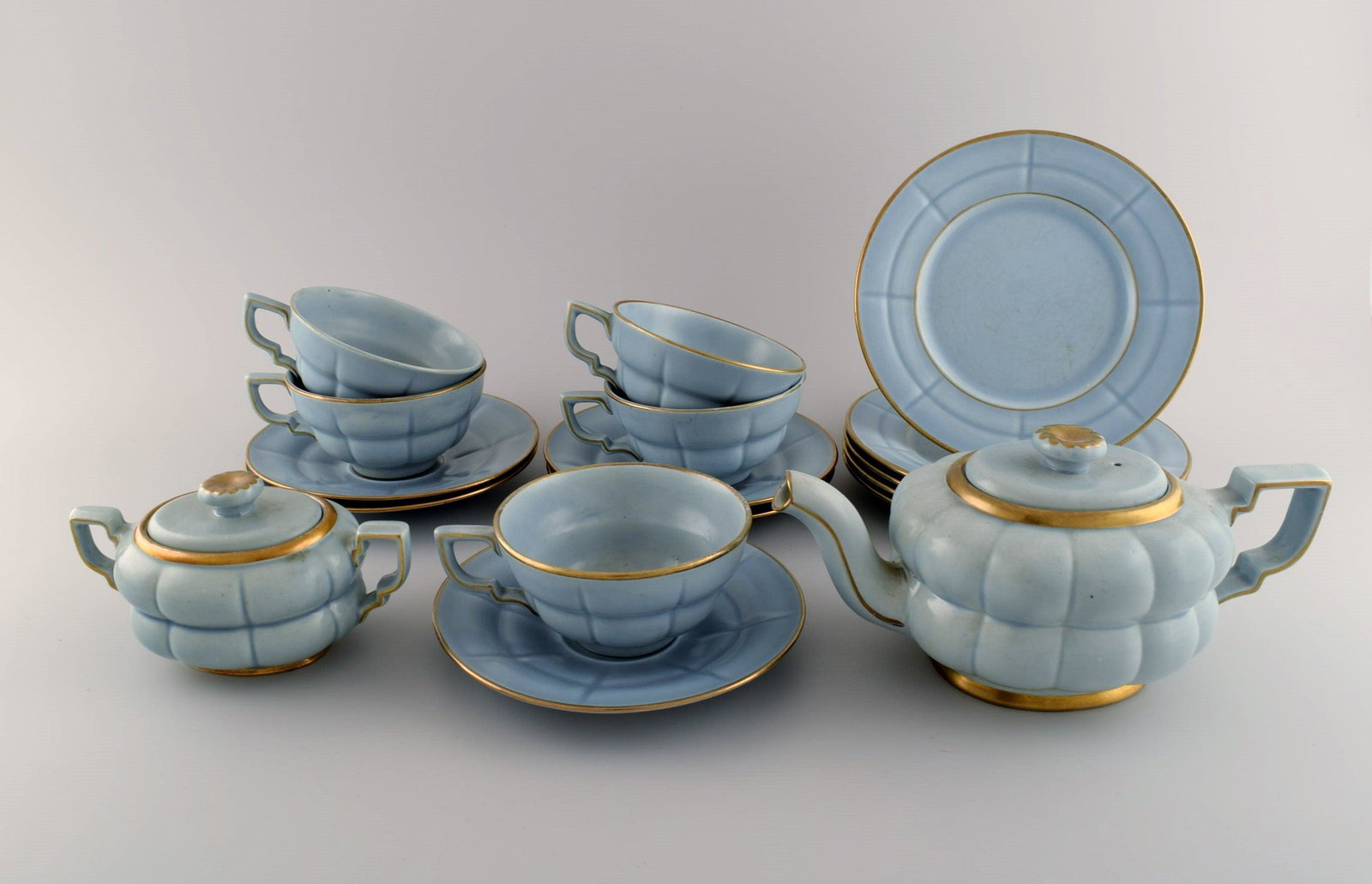 Arthur Percy for Upsala-Ekeby / Gefle. Complete art deco Grand tea service in pastel blue porcelain: Arthur Percy for Upsala-Ekeby / Gefle. Complete art deco Grand tea service in pastel blue porcelain with hand-painted gold edge for five people. 1930s / 40s. Consisting of five teacups with saucers, f