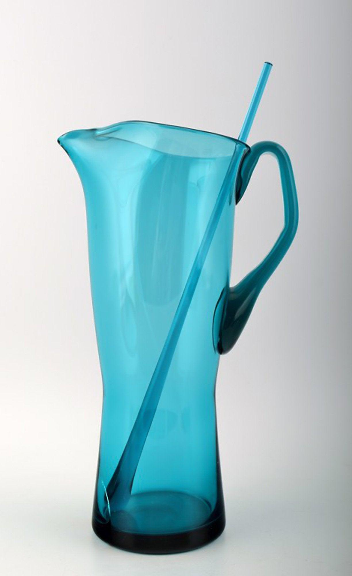 Orrefors Lemonade pitcher with stir stick in green blue glass.: Orrefors Lemonade pitcher with stir stick in green blue glass, modern Scandinavian design, 1960s. Unstamped. Art Glass. Measures 27.5 cm. In good condition with chip inside. Reserve: $60.00 Shipping: