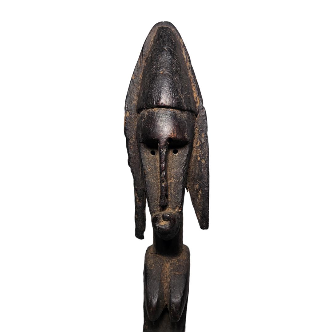 Bamanan Statue: Title: Bamanan Statue Date/Period: 19th Century Materials/Origin: Mali , Africa Dimensions: 3.5in X 4in X 27in Reserve: $220.00 Shipping: Domestic: Flat-rate of $30.00 to anywhere within the conti