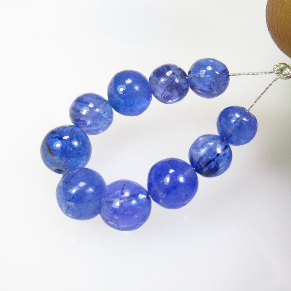 13.00 Ctw Natural Drilled Tanzanite Round Ball Beads: Title: 13.00 Ctw Natural Drilled Tanzanite Round Ball Beads Stone Clarity: Transparent Gemstones: Natural Tanzanite Beads Carat Weights: 13 Size/Dimensions: 5.00 - 6.00 mm / 10 P'cs Additional Informa