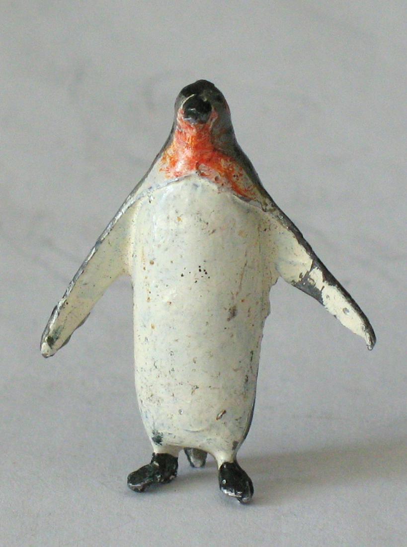 Vintage cast metal Penguin paper weight. (1 of 4)