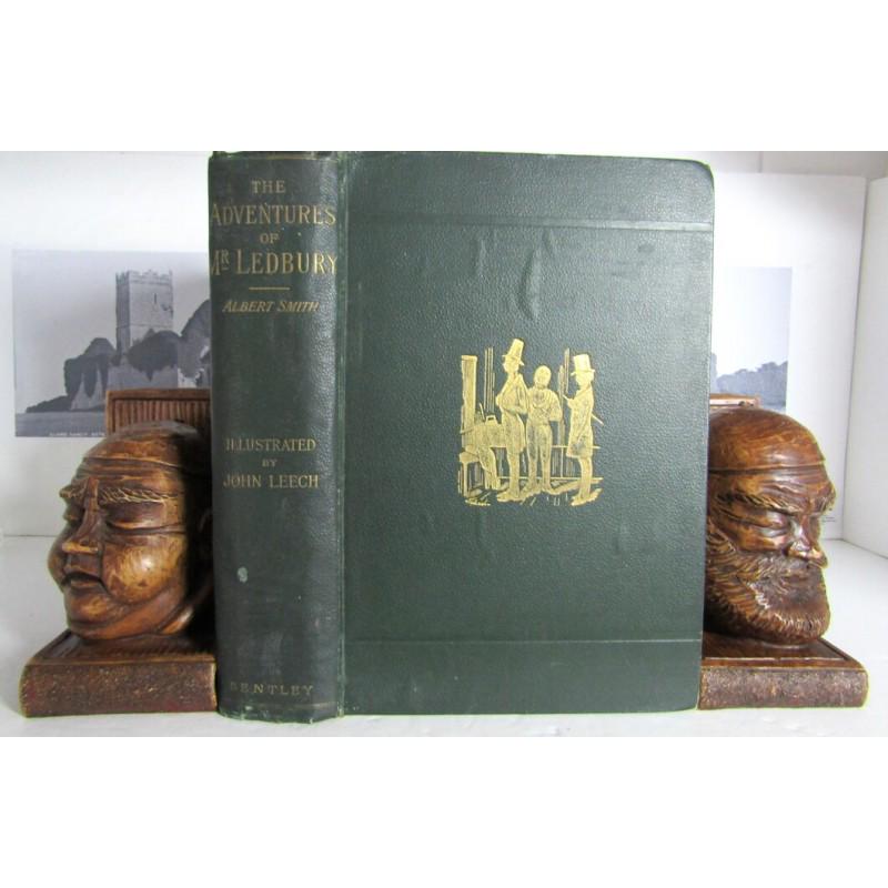 The Adventures of Mr. Ledbury and his friend Jack Johnson: First edition. 'Illustrated with twenty-one full-page etchings on steel by John Leech.' Publishers green buckram with gilt vignette. Gilt title to spine. Decorative green endpapers. Frontispiece plate