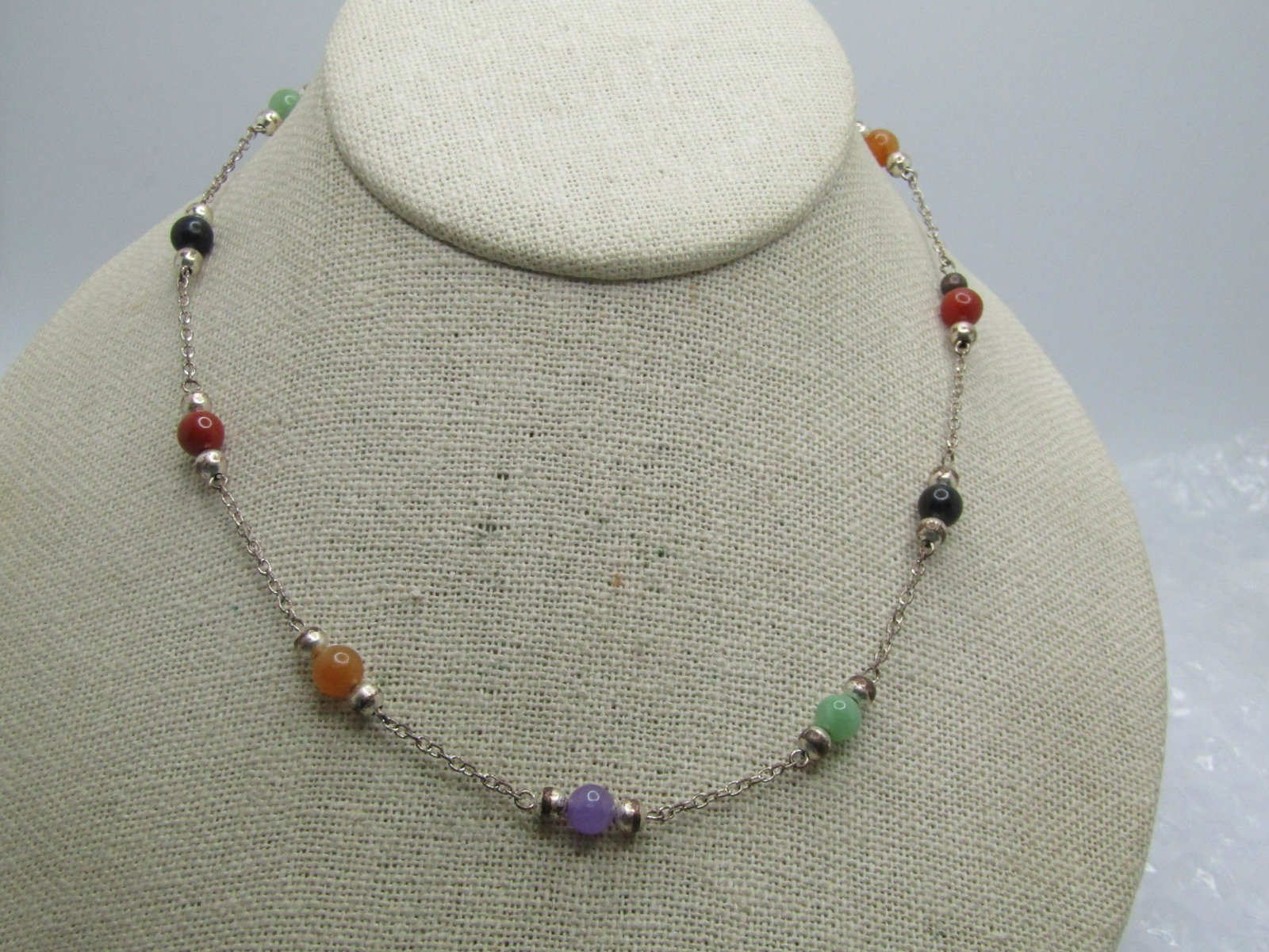 Vintage Sterling Jade, Onyx, Carnelian Necklace, 16", Signed: Vintage Sterling Jade, Onyx, Carnelian Necklace, 16", Signed HAN. The necklace is marked sterling and tested with a weight of appx. 8.29 gr. It has6mm round beads, green jade, purple jade, orange jade