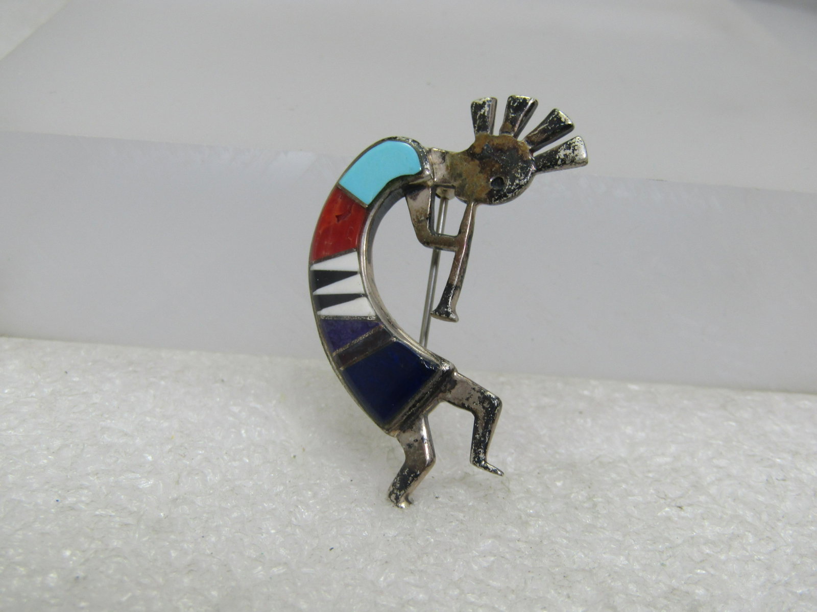 Vintage Sterling Inlaid Kokopeli Broch, Native American, Signed B.G. Mudd: Vintage Sterling Inlaid Kokopeli Broch, Native American, Signed B.G. Mudd with compass points. Inlaid in turquoise, onyx, spiny oyster, white unknown, sugalite, and lapis luzili. The spiny oyster has 