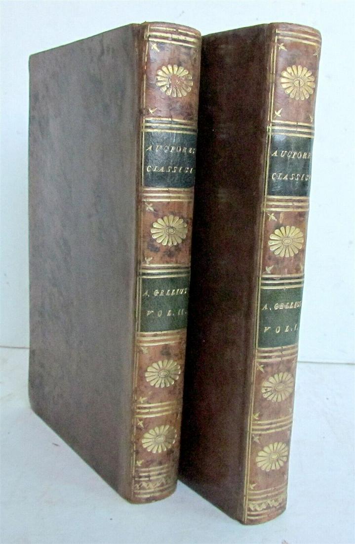 1784 GELLIUM 2 VOLUMES AUTORES CLASSICI SERIES ANTIQUE NOCTIUM ATTICARUM: AUTORES CLASSICI SERIES AULII GELLII NOCTIUM ATTICARUM Biponti; 1784 2 volumes Size 5 by 8" text in latin Original calf bindings , gilt spines. With dampstains Armorial bookplate with motto "Je Vive E