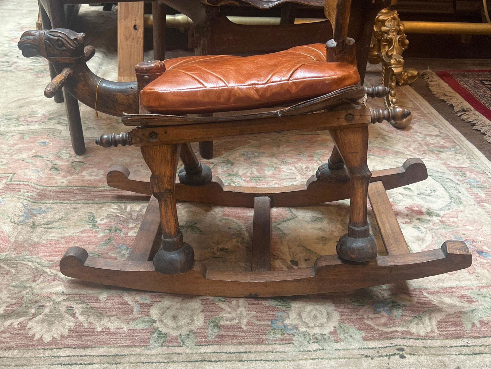 Vintage Turkish Design Carved Wood Rocking Camel: Vintage from the 1930s Materials: leather, wood Description Vintage Turkish Design Carved Wood Rocking Camel One of a kind and unique carved wood rocking camel. It’s a child’s size, hand m