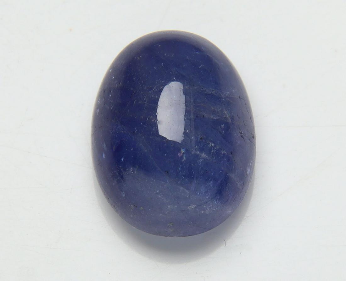 8.27 Cts Natural Tanzanite: No Reserve! Title: 8.27 Cts Natural Tanzanite Additional Information: Gemstone : Natural Tanzanite Origin: Tanzania Weight : 8.27 carats Dimensions : 13.45x10.28x6.92 mm Shape/Cut: Oval Cabochan Color