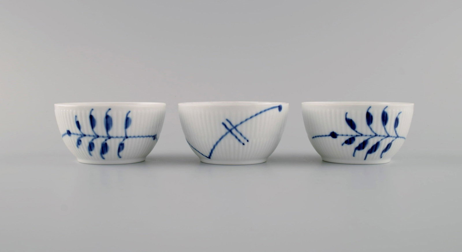 Three small Royal Copenhagen Blue Fluted Mega bowls. 21st Century. Model number 155.: Three small Royal Copenhagen Blue Fluted Mega bowls. 21st Century. Model number 155. Measures: 8.5 x 4.5 cm. In excellent condition. Stamped. 1st factory quality. Reserve: $95.00 Shipping: Domestic: S