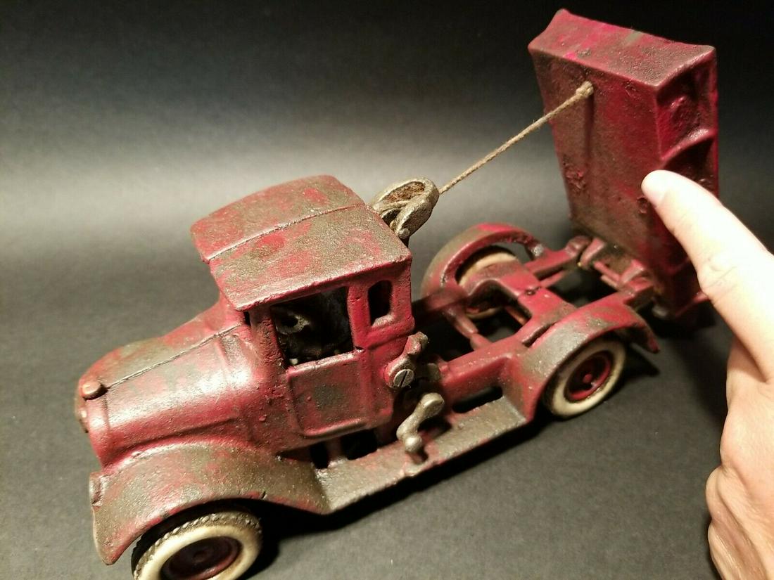 Cast Iron Red Dump Truck Flat bed Car Rubber Wheels: 10 1/4" Long x 3 1/4" Wide 4 1/8" Tall Such a neat reproduction cast iron tow truck! As you can see this heavy cast iron truck was wonderfully hand painted and distressed to look original. The car is