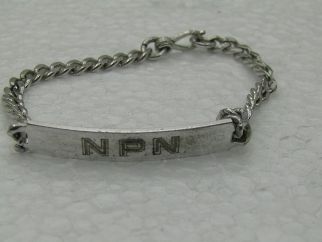 Vintage Sterling Silver Engraved NPN Bracelet, 6.5" , 6.3mm wide. Elco: Vintage Sterling Silver Engraved NPN Bracelet, 6.5" , 6.3mm wide. Elco signed. Weight is appx. 8.44 grams. The engraved portion is 6.3mm wide and the chain is 4mm wide. Age is appx. 1960's. Curb-Link.