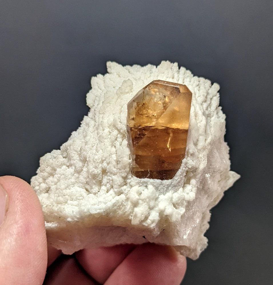 106 Grams Very Beautiful Brown Topaz on Matrix From Skardu Pakistan: Materials: Brown Topaz on Matrix 106 Grams Very Beautiful Brown Topaz on Matrix From Skardu Pakistan . Size 4.1 CM X 4.9 CM X 4.5 CM Reserve: $40.00 Shipping: Domestic: Flat-rate of $14.00 to anywhere