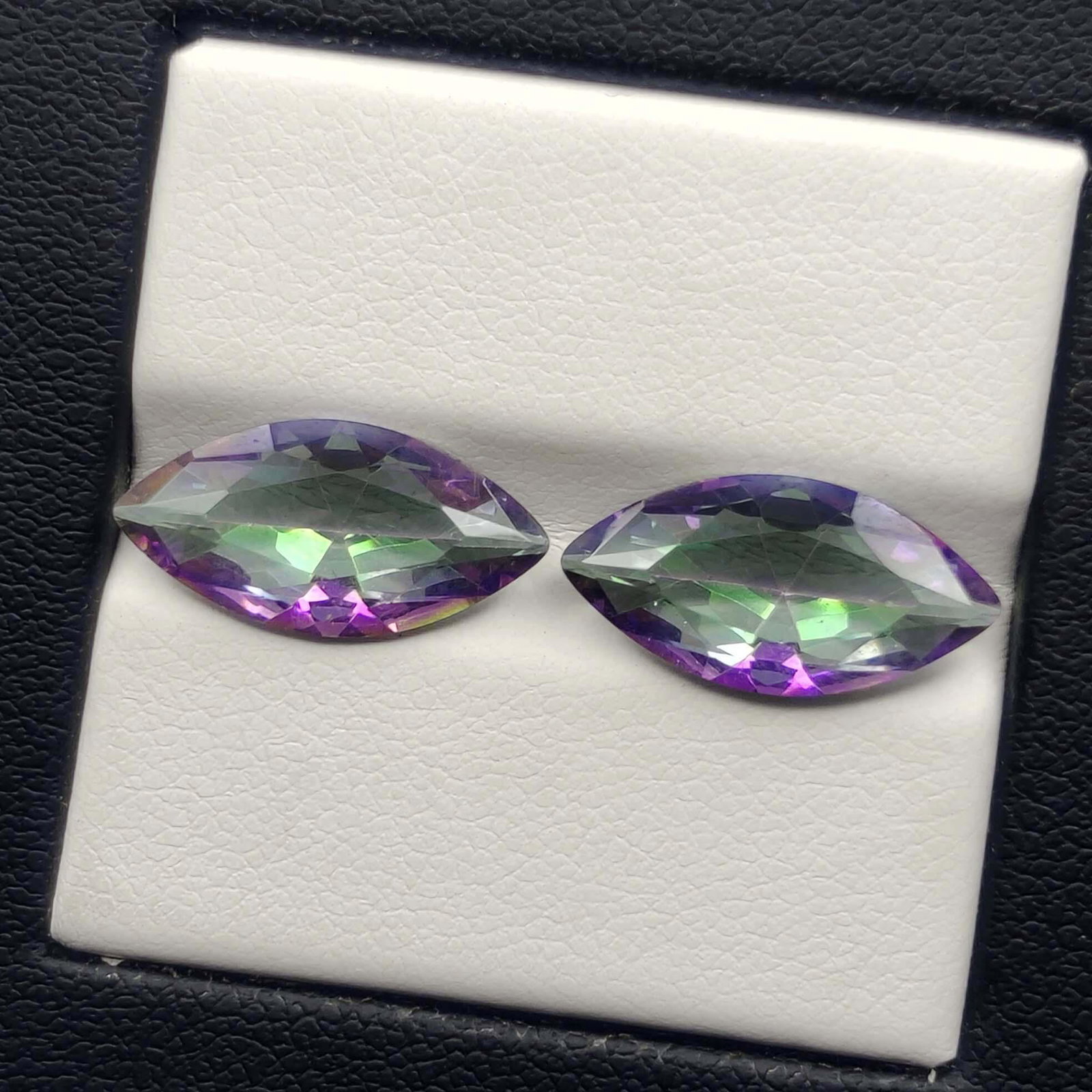 5.40 ct Natural Mystic Quartz pair: No Reserve! Title: 5.40 ct Natural Mystic Quartz pair Additional Information: Gemstones: Natural Mystic Quartz Carat Weights: 5.40 ct Size/Dimensions: 16 X 8 mm Treatment: Coated Materials & Technique
