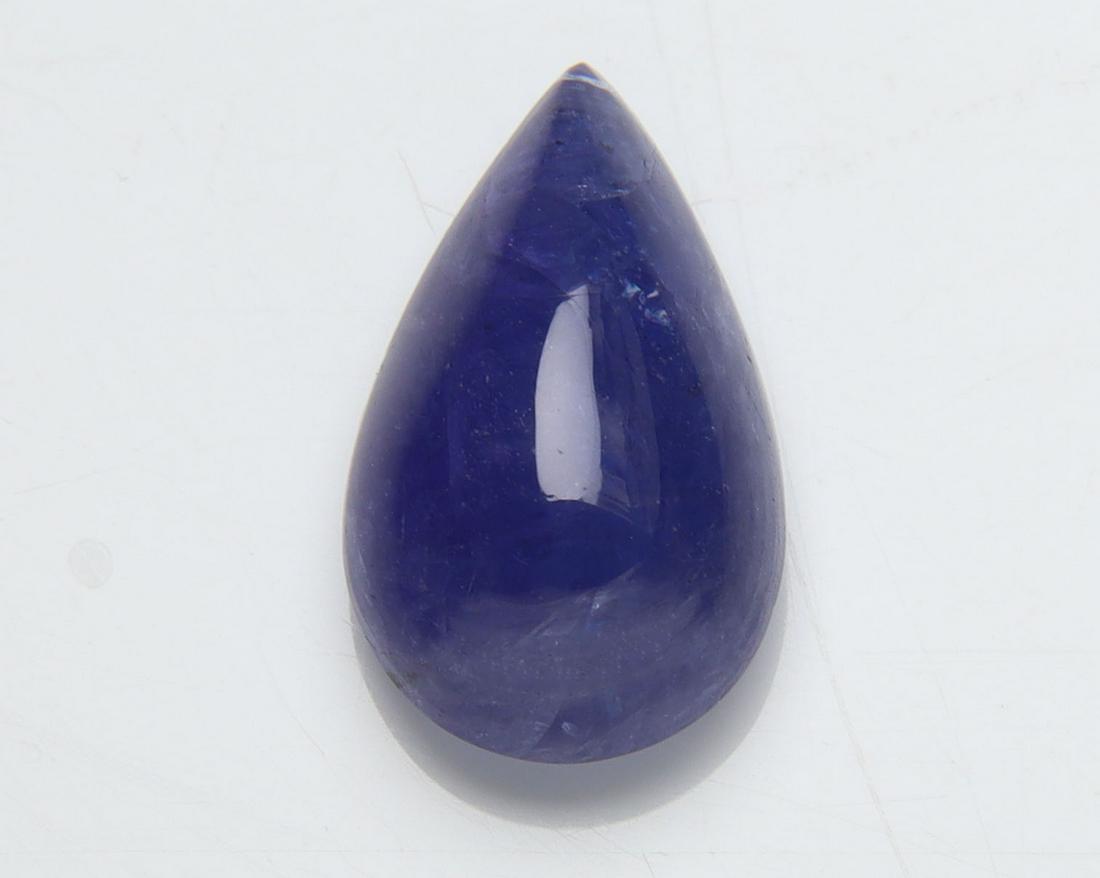 4.46 Cts Natural Tanzanite: No Reserve! Title: 4.46 Cts Natural Tanzanite Additional Information: Gemstone : Natural Tanzanite Origin: Tanzania Weight : 4.46 carats Dimensions : 13.56x8.07x5.47 mm Shape/Cut: Pear Cabochan Color 