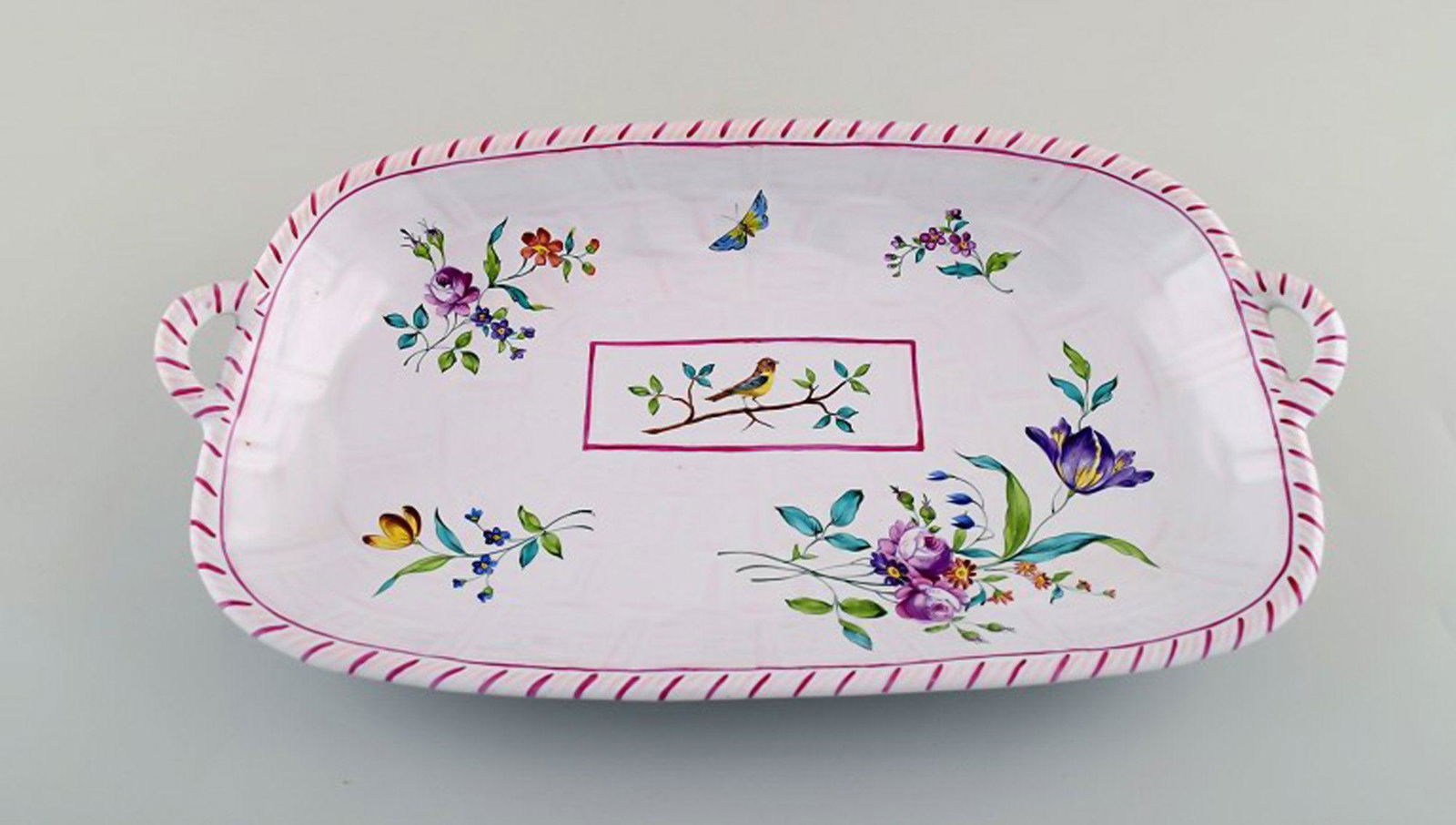 Emile Gallé for St. Clement, Nancy. Dish on four feet in hand-painted faience. Decorated with: Title: Emile Gallé for St. Clement, Nancy. Dish on four feet in hand-painted faience. Decorated with flowers and birds. 1870's. Description: Emile Gallé for St. Clement, Nancy. Dish on four