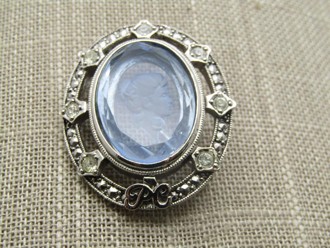 Vintage Blue Glass Intaglio Cameo Brooch, Avon 1998-1999 President's Recognition: Vintage Blue Glass Cameo Brooch, Avon 1998-1999 President's Recognition Program with PC for President's Club on the base of the brooch under the reverse cameo . It has open space between the frame wit