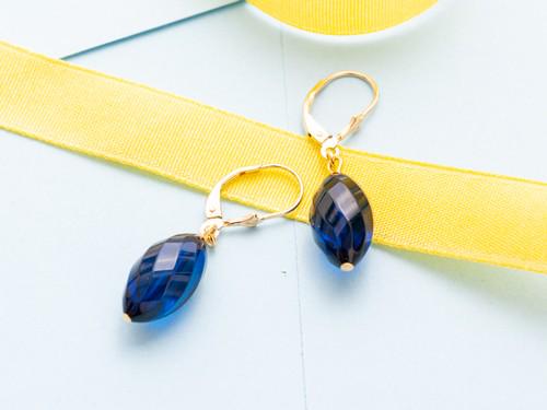 Blue Amber Earrings made of faceted olive shape amber and lever back closure (1 of 6)