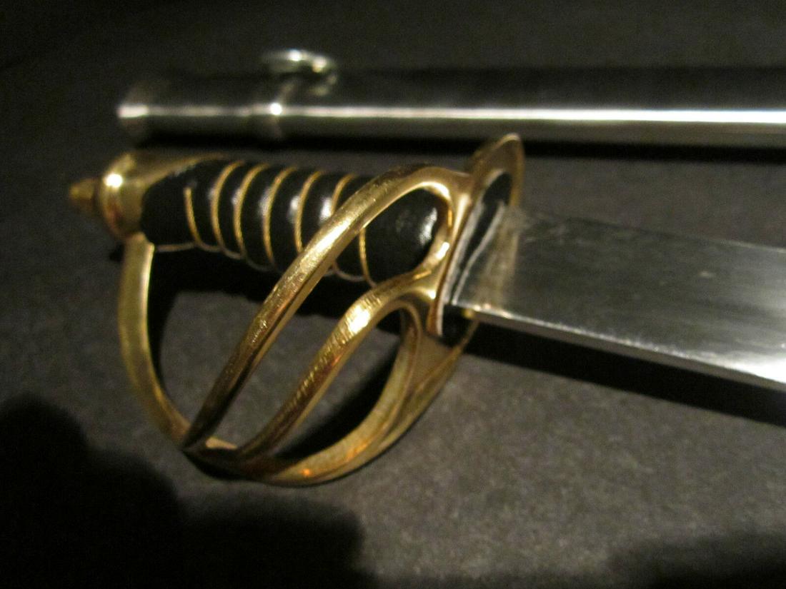 26" Small Cavalry Civil War Carbon Steel Sword: 26" Long with scabbard 28" 3" Grip 2 lb 1 oz Nice reproduction of a small 1960 saber solid brass carbon steel blade steel scabbard. . Please note the 3" handle is made for smaller hands. Please see al