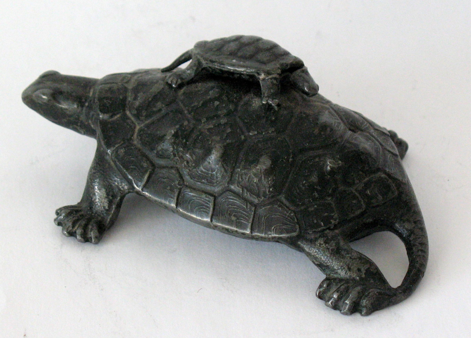 Antique cast metal turtle with baby paper weight.: Title: Antique cast metal turtle with baby paper weight. Date/Period: 1930's Dimension: 4” x 2 1/2” Additional Information: Interesting antique cast metal turtle with baby paper weight in 