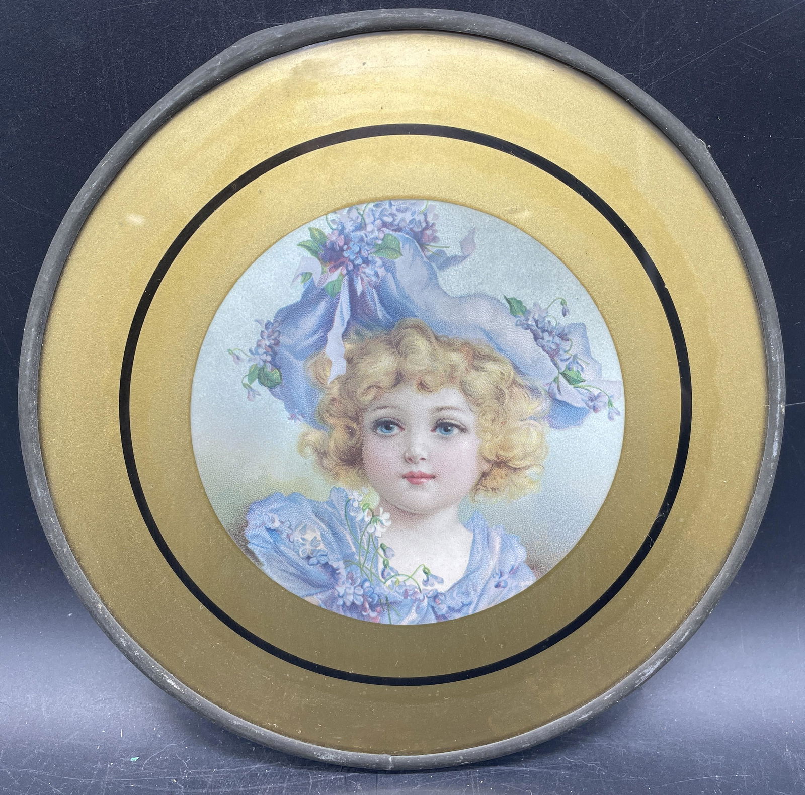 ANTIQUE FLUE COVER-VICTORIAN LITTLE GIRL PORTRAIT: Title: ANTIQUE FLUE COVER-VICTORIAN LITTLE GIRL PORTRAIT Date/Period: UNKNOWN Dimension: 8" DIAMETER Material: mixed materials Additional Information: ANTIQUE FLUE COVER-VICTORIAN LITTLE GIRL PORTRAIT