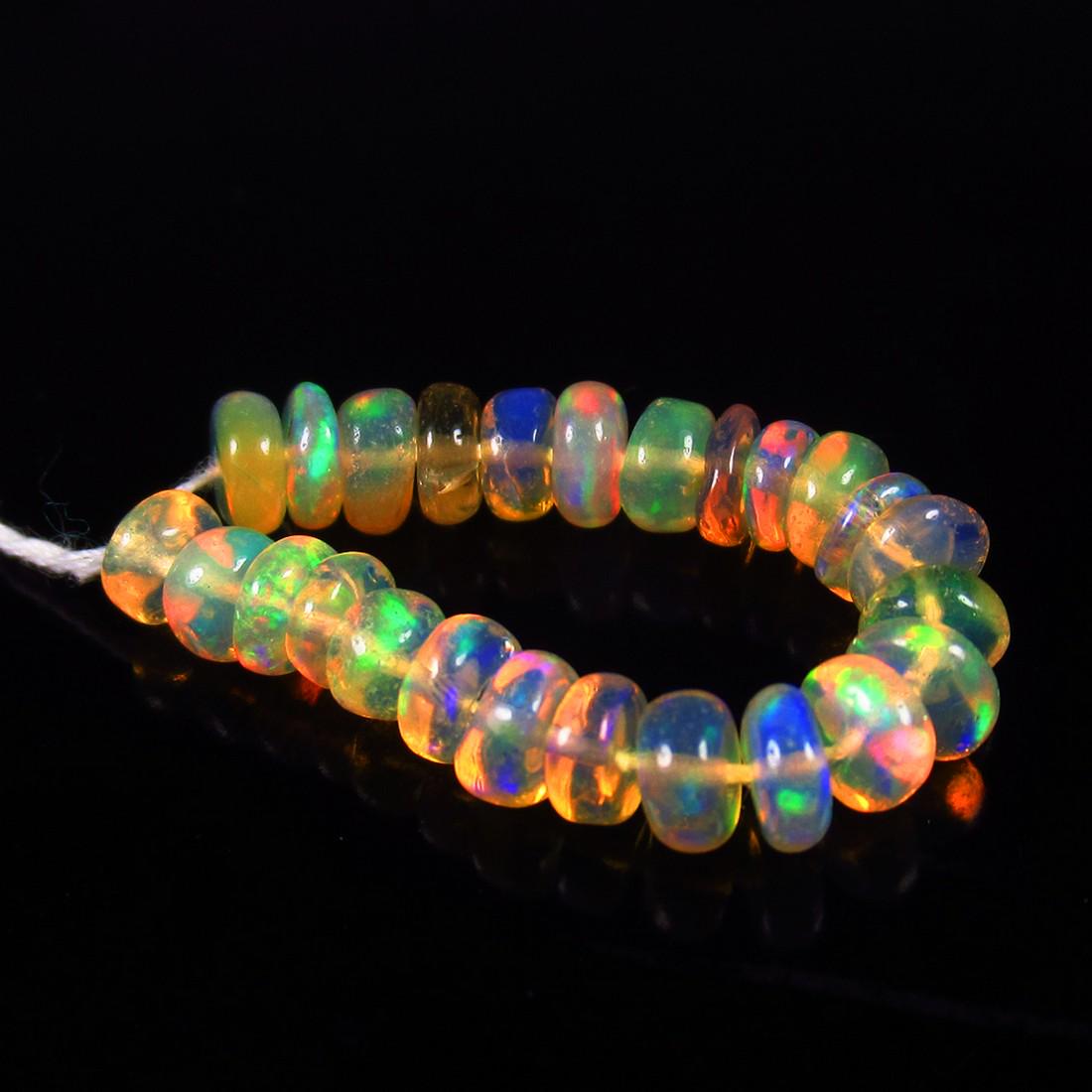 Natural Multicolor Opal Beads - 3.95 Ct: No Reserve! Title: Natural Multicolor Opal Beads - 3.95 Ct Origin: Ethiopia Weight: 3.95 Size/Dimensions: 4.8 - 5.2 mm Additional Information: Pieces : 25 No's / Shape : Drilled Round Beads / Clarity 