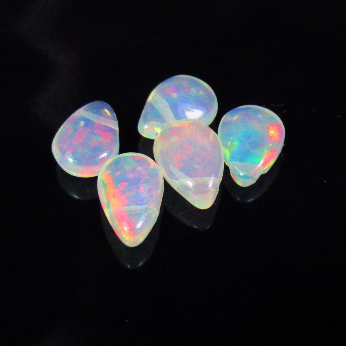 2.15 Ctw Natural 5 Drilled Pear Multi-Color Fire Opal Beads: No Reserve! Title: 2.15 Ctw Natural 5 Drilled Pear Multi-Color Fire Opal Beads Stone Clarity: Transparent Gemstones: Natural Pear Opal Beads Carat Weights: 2.15 Size/Dimensions: 7.2x5.1 - 7.5x5.0 mm /