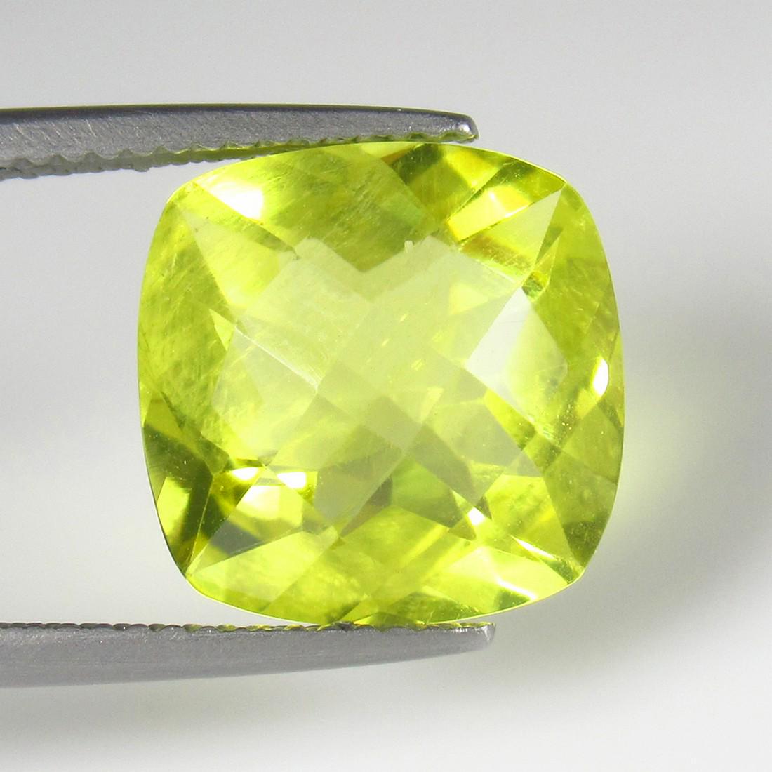 Natural Lemon Quartz - 6.63 Ct: No Reserve! Title: Natural Lemon Quartz - 6.63 Ct Origin: Africa Weight: 6.63 Size/Dimensions: 12.0 x 12.0 x 8.0 mm Additional Information: Pieces : 1 No's / Shape : Cushion Cut / Color : Greenish Yel