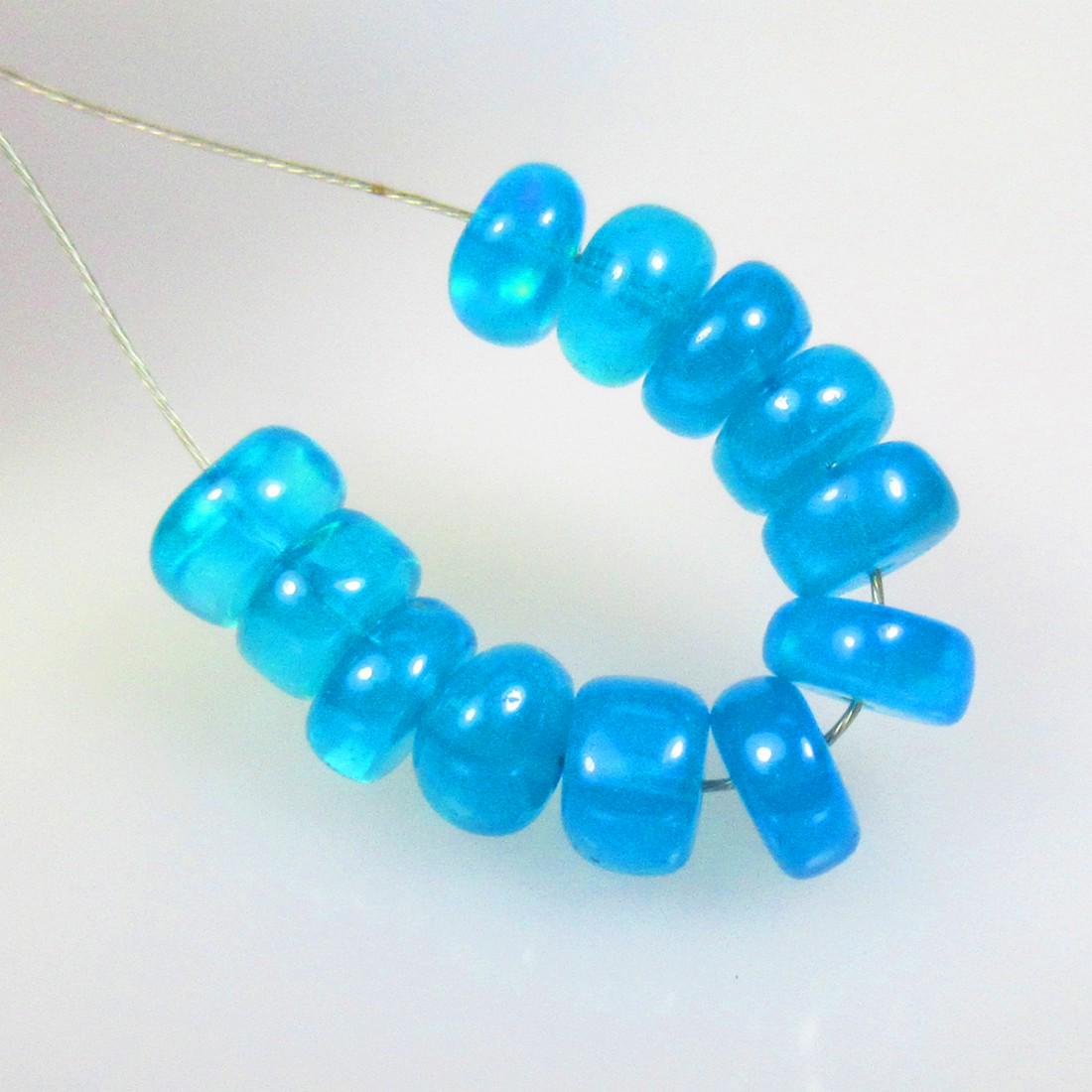 5.21 Ctw Natural 12 Drilled Neon Blue Fire Opal Beads: No Reserve! Title: 5.21 Ctw Natural 12 Drilled Neon Blue Fire Opal Beads Stone Clarity: Translucent Gemstones: Natural Opal Beads Carat Weights: 5.21 Size/Dimensions: 5.00 to 5.50 mm / 12 PC's Additio