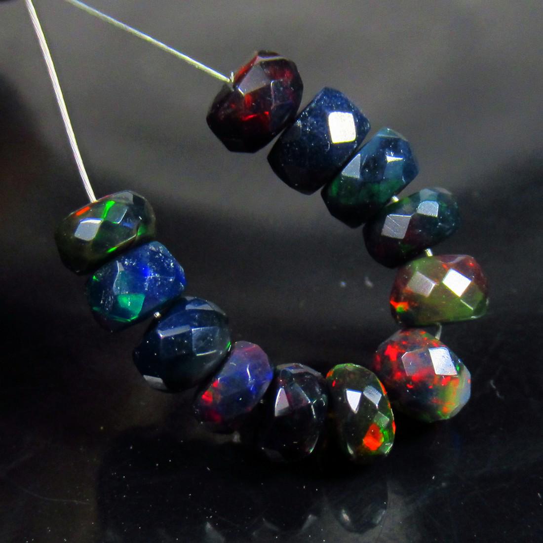 4.76 Ct Natural 12 Drilled Faceted Black Fire Opal Beads: No Reserve! Title: 4.76 Ct Natural 12 Drilled Faceted Black Fire Opal Beads Stone Clarity: Translucent Gemstones: Natural Faceted Black Opal Beads Carat Weights: 4.76 Size/Dimensions: 4.80 to 5.20 mm 