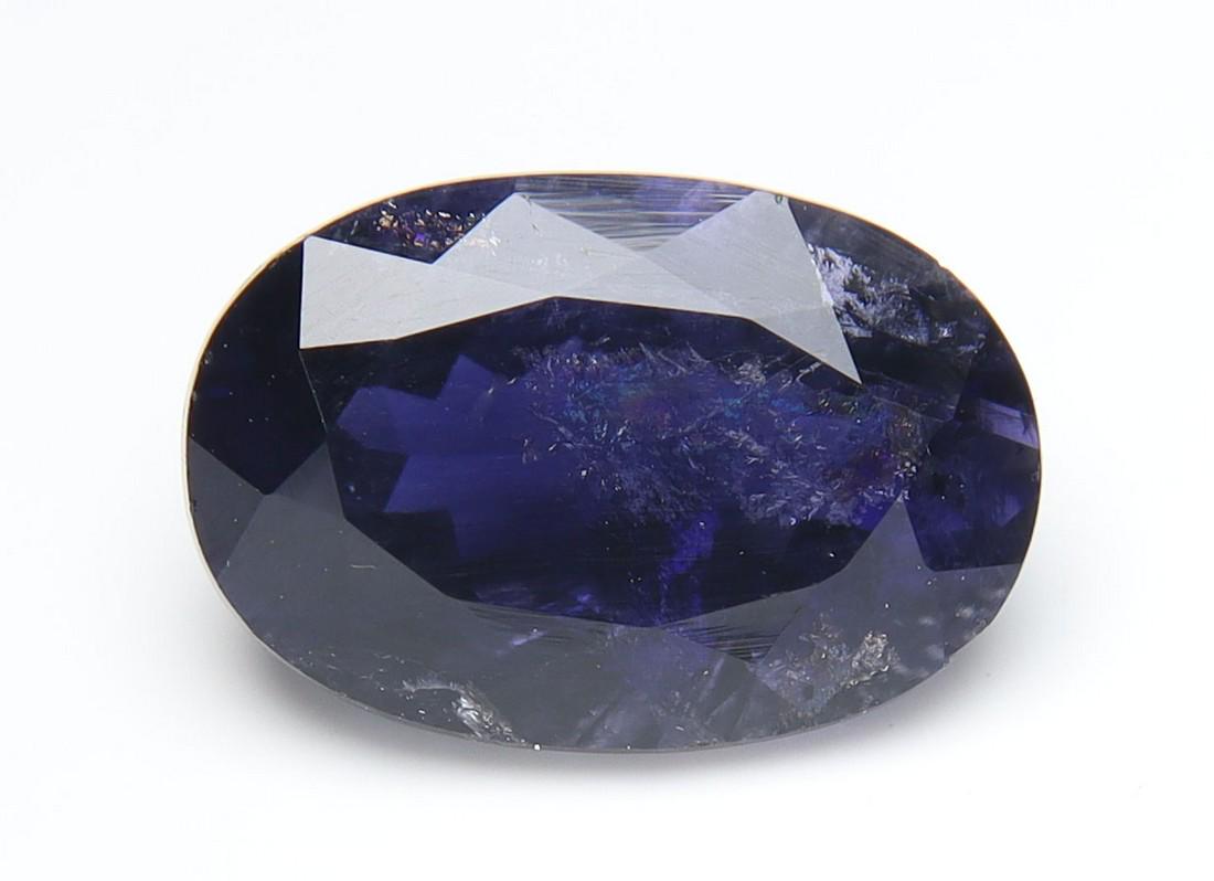 2.45 cts Natural Iolite: No Reserve! Title: 2.45 cts Natural Iolite Additional Information: Gemstone : Natural Iolite Shape and cut : Oval Cut Weight : 2.45 carats Measurements : 11.21x7.56x5.21 mm Color : Violite Transparenc