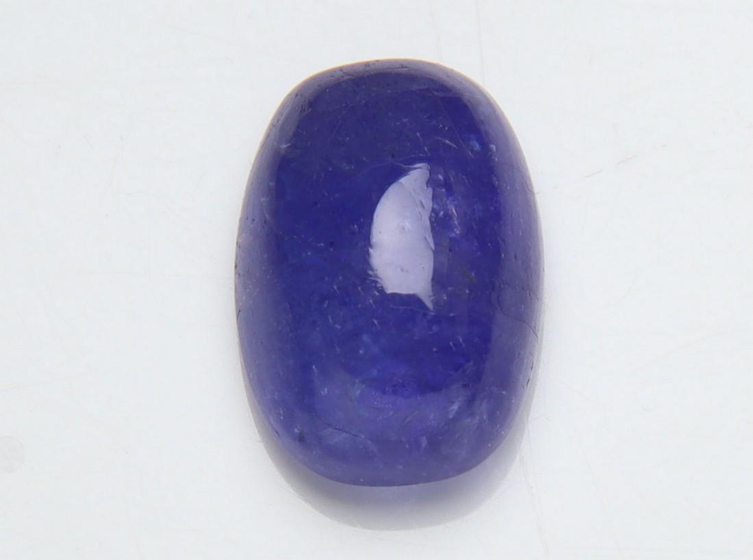 4.04 Cts Natural Tanzanite: No Reserve! Title: 4.04 Cts Natural Tanzanite Additional Information: Gemstone : Natural Tanzanite Origin: Tanzania Weight : 4.04 carats Dimensions : 11x8 mm Shape/Cut: Rectengular Cabochan Color : Vi