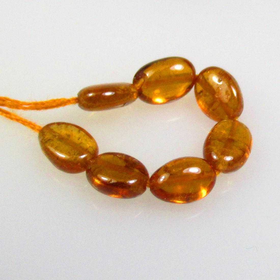 5.95 Ctw Natural Drilled Hessonite Garnet Oval Beads: No Reserve! Title: 5.95 Ctw Natural Drilled Hessonite Garnet Oval Beads Stone Clarity: Transparent Gemstones: Natural Hessonite Garnet Carat Weights: 5.95 Size/Dimensions: 6.2x4.2 - 6.5x4.7 mm / 7 Pc'