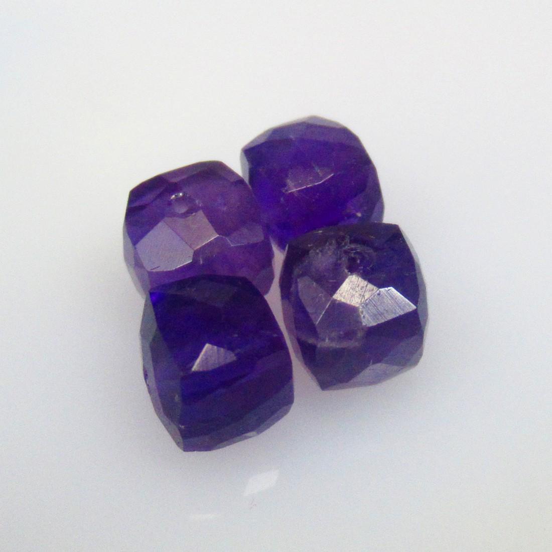 8.97 Ctw Natural 4 Drilled Purple Amethyst Square Beads: No Reserve! Title: 8.97 Ctw Natural 4 Drilled Purple Amethyst Square Beads Stone Clarity: Transparent Gemstones: Natural Amethyst Beads Carat Weights: 8.97 Size/Dimensions: 6.6x6.1 - 6.8x6.8 mm / 4 Pc
