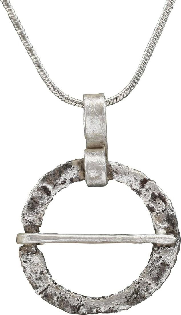 VIKING PROTECTIVE BROOCH NECKLACE 10th-11th CENTURY AD: Bronze, under 1” (0.90”) diameter. Low rounded face with flat back. The edge notched for the cross pin. Textured from burial. Worn in numbers, these were decorative as well as serving as a