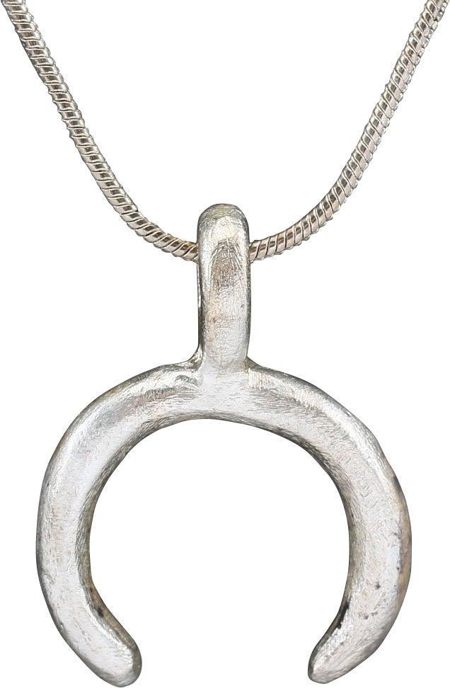 VIKING LUNAR PENDANT C.900-1000 AD: About 3/4" width. As expert navigators, the constellations signified mystery and power to Vikings. The Moon was personified as Mani, brother to Sol the Sun, and is abundantly represented in Norse lite