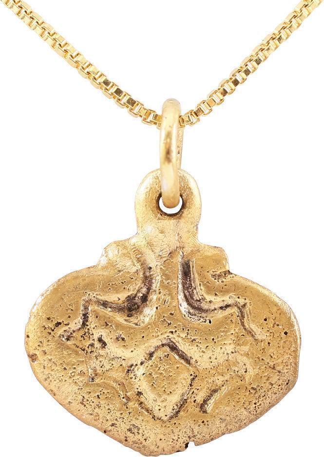 FINE VIKING HEART PENDANT C.10TH-11TH CENTURY AD: 17.3mm, 0.68" total height. Elegant from with rudimentary cusp to the top and pointed bottom. Thick with a broad rounded edge and high relief, well delineated, central trefoil. Made by the open face m