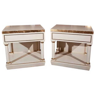 Pair of White Painted End Tables/Nightstands: Pair of end tables/nightstands, overall white painted and parcel-gilt, attributed to Grosfeld Housee, the top over a single drawer supported by columnar uprights, raised on block base. Dimensions: